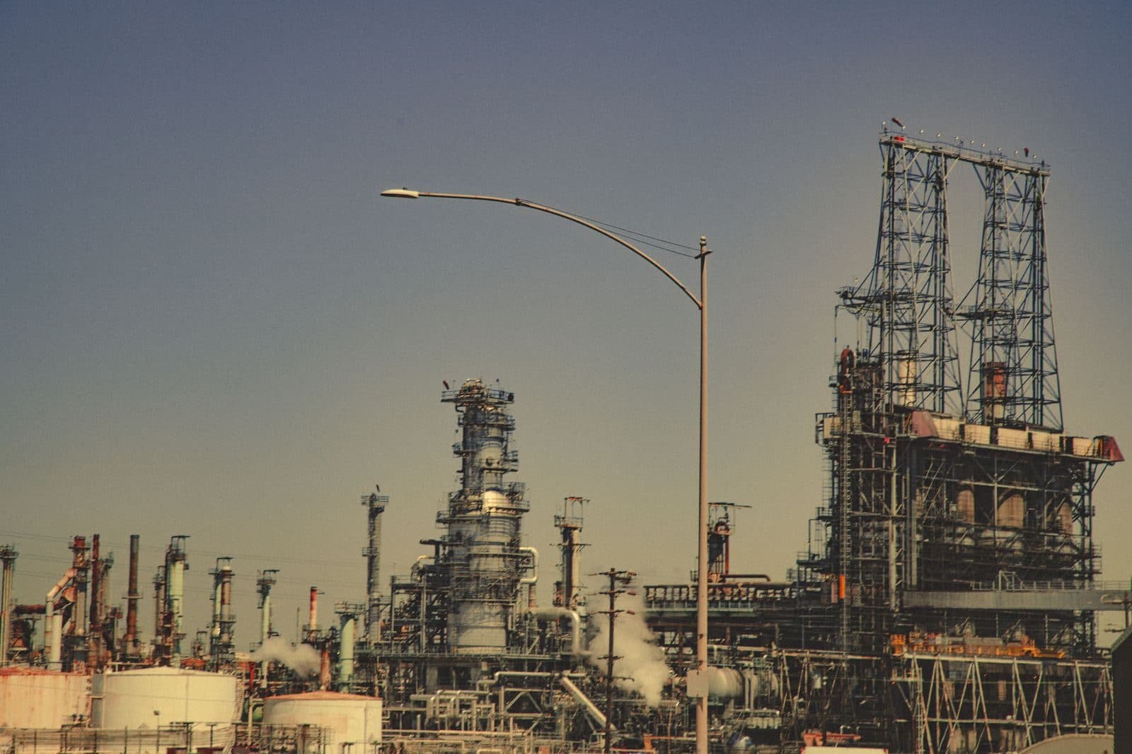 Refinery towers and stacks at dusk