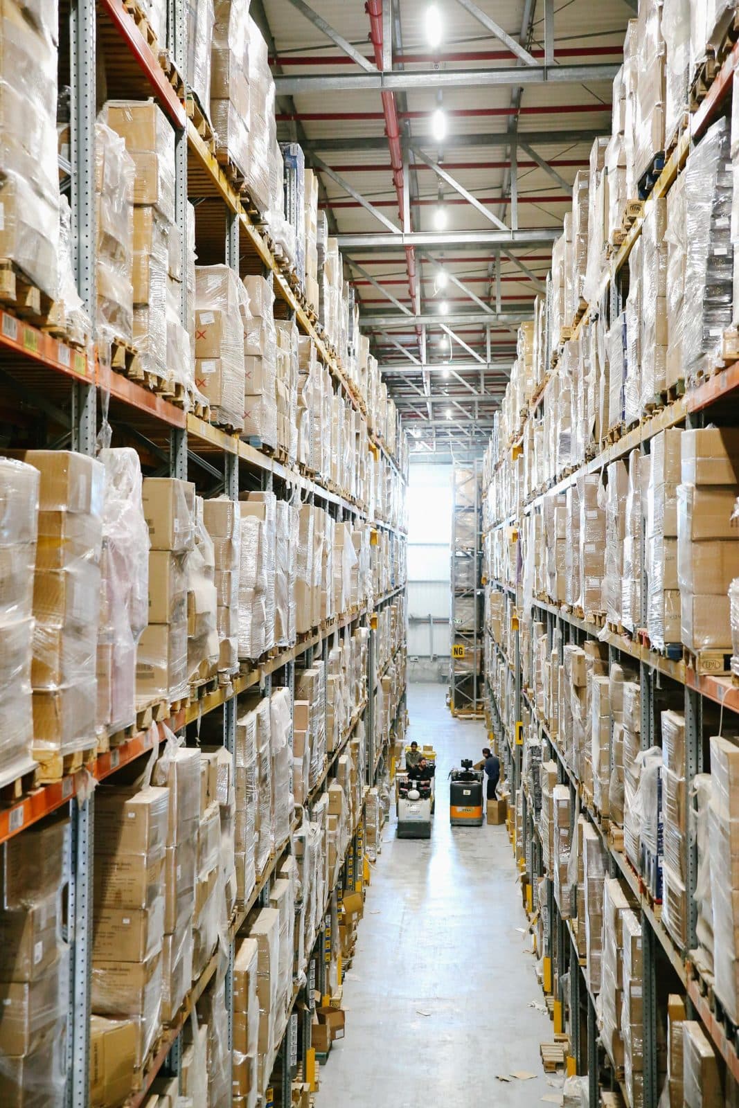 High-bay warehouse aisle with stacked pallets