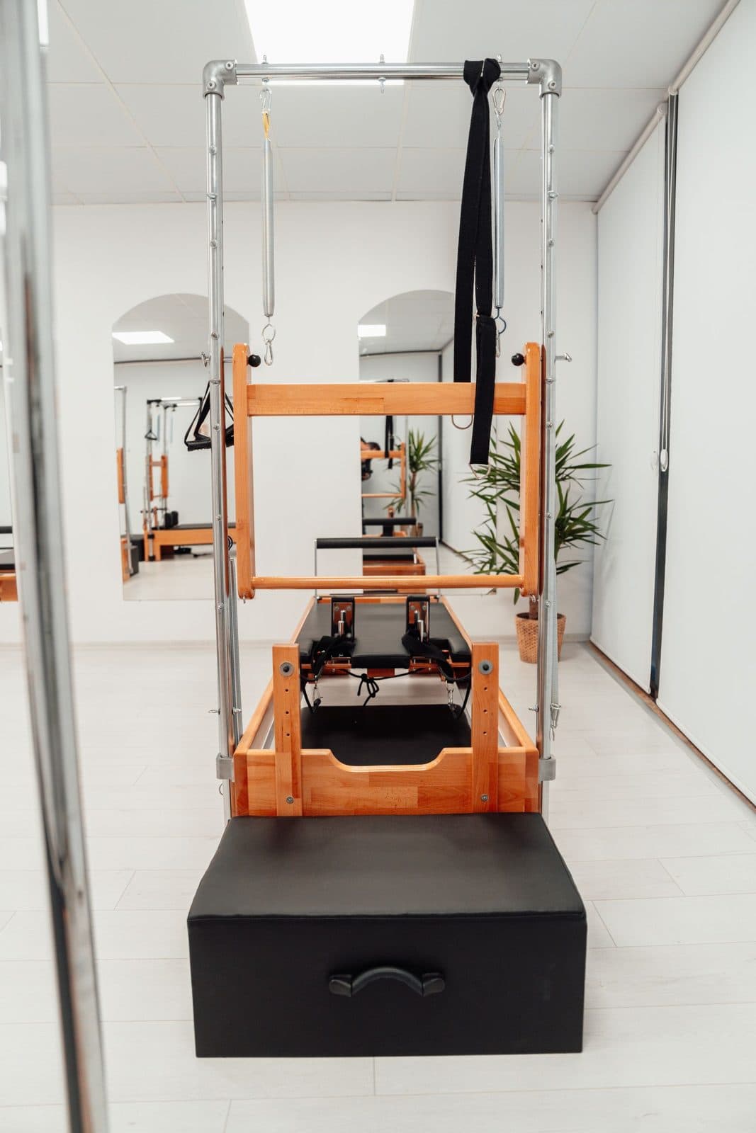 Pilates reformer equipment in a bright studio