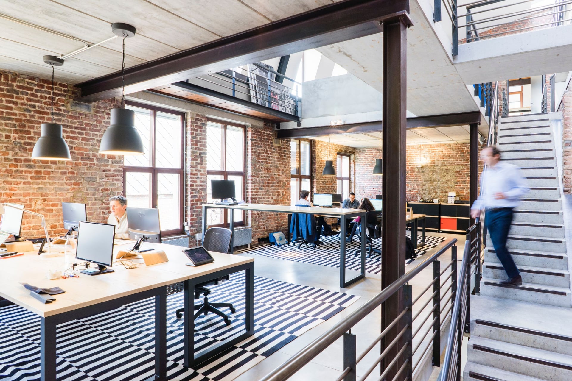 A software team building operational systems in a daylit studio